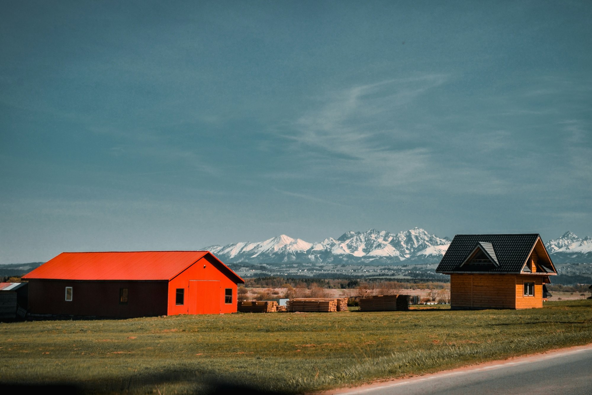 Podhale farm with snow-capped Tatra mountains